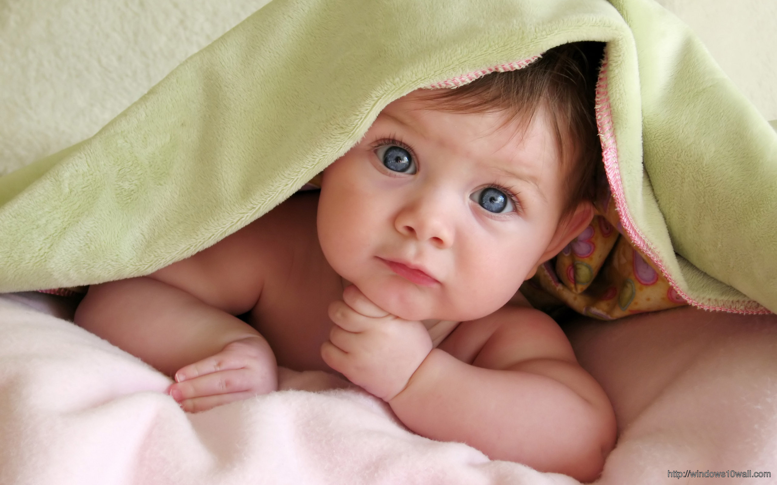 Lovely Baby with Towel Coverd Background Wallpaper