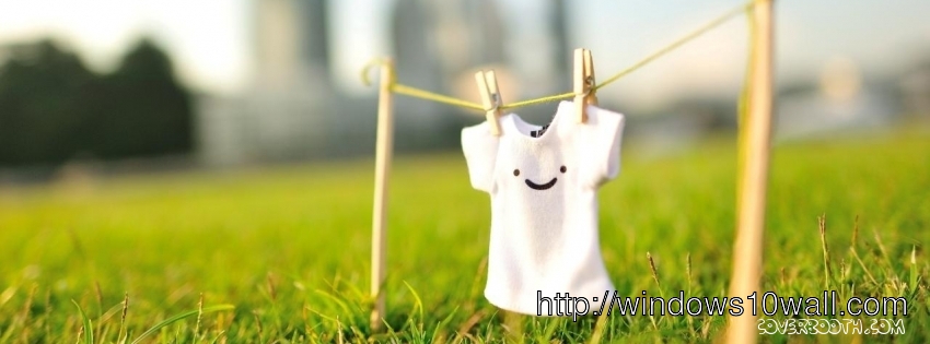 white tshirt with smiley hanged over green meadow facebook timeline background cover
