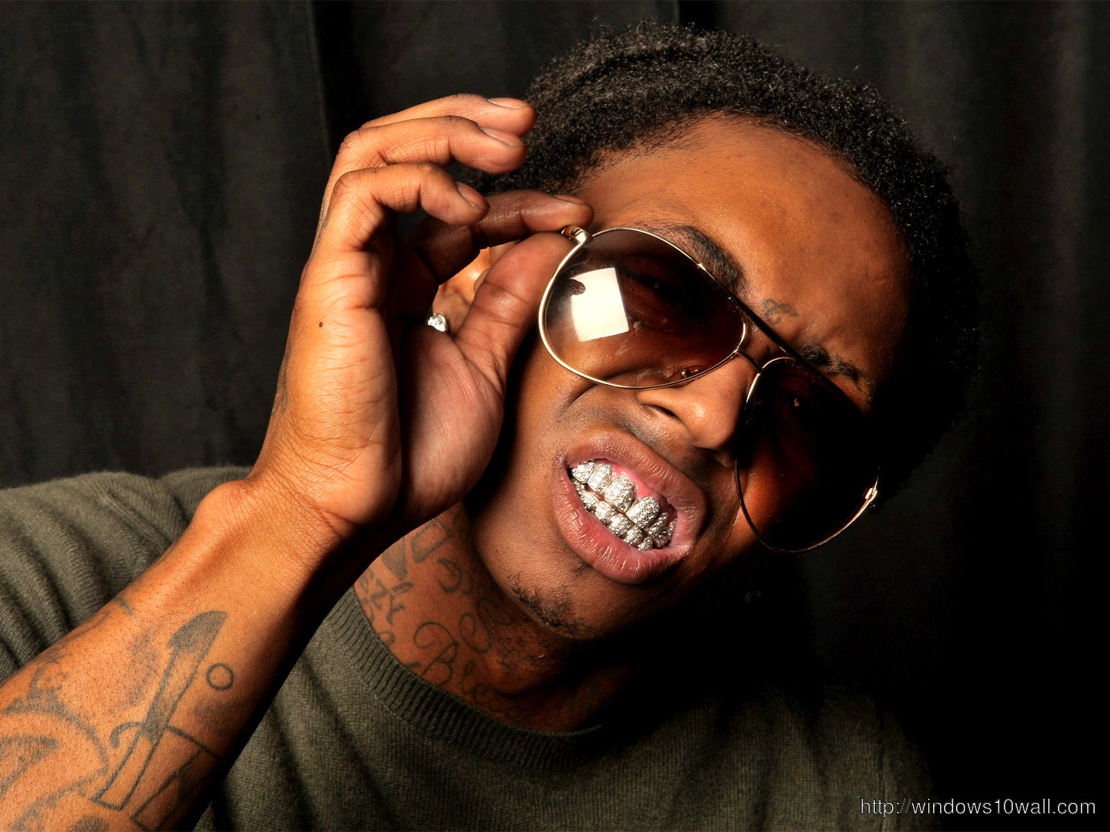 Lil Wayne Playing with Glasses Background Wallpaper
