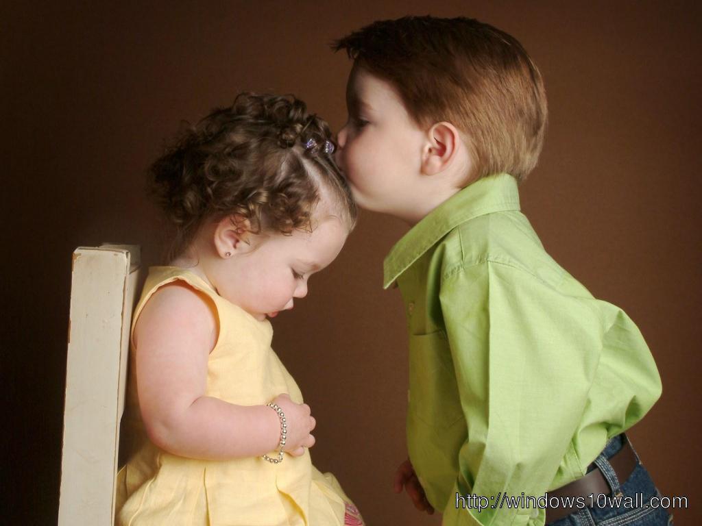 Cute Baby Couple Kissing on Head Wallpaper