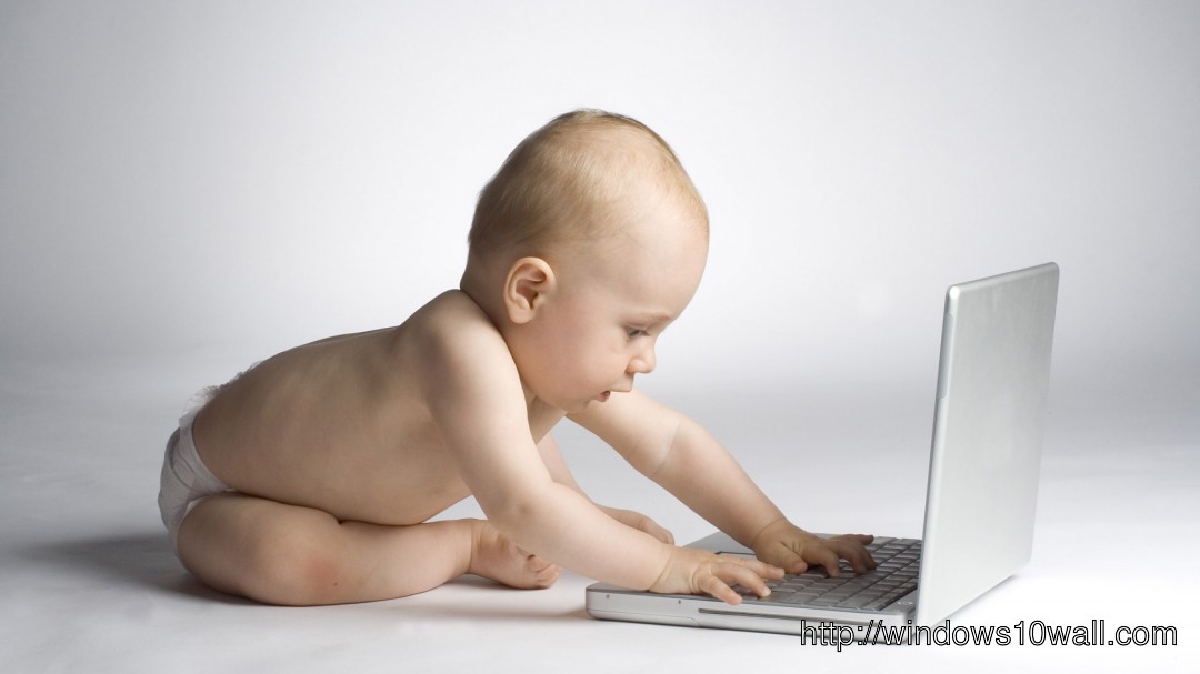 Funny Cuty Baby Boy Playing With Laptop